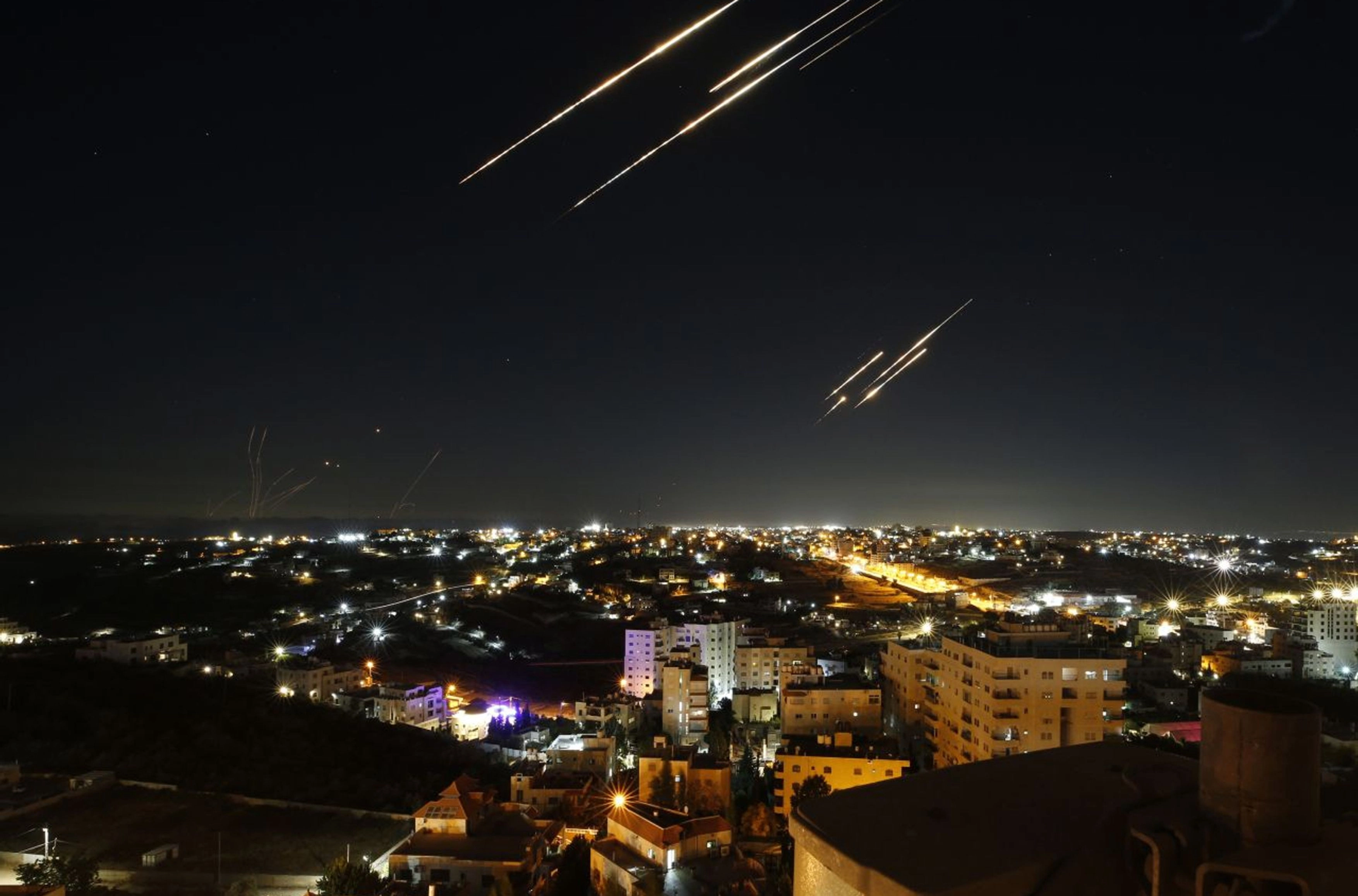 Missiles launched from Iran fly over the sky of Hebron in the West Bank on June 18