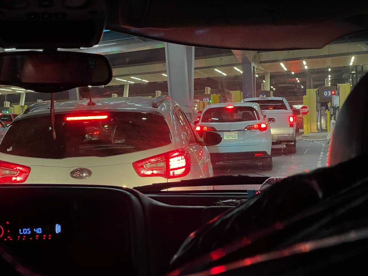 A line of vehicles at the U.S.–Mexico border